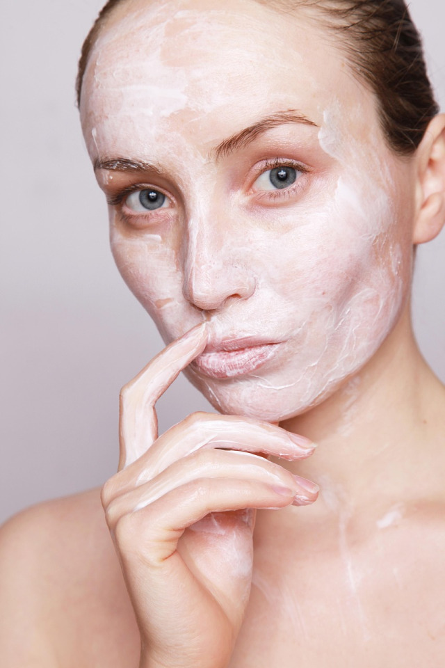 hands applying gentle facial skincare